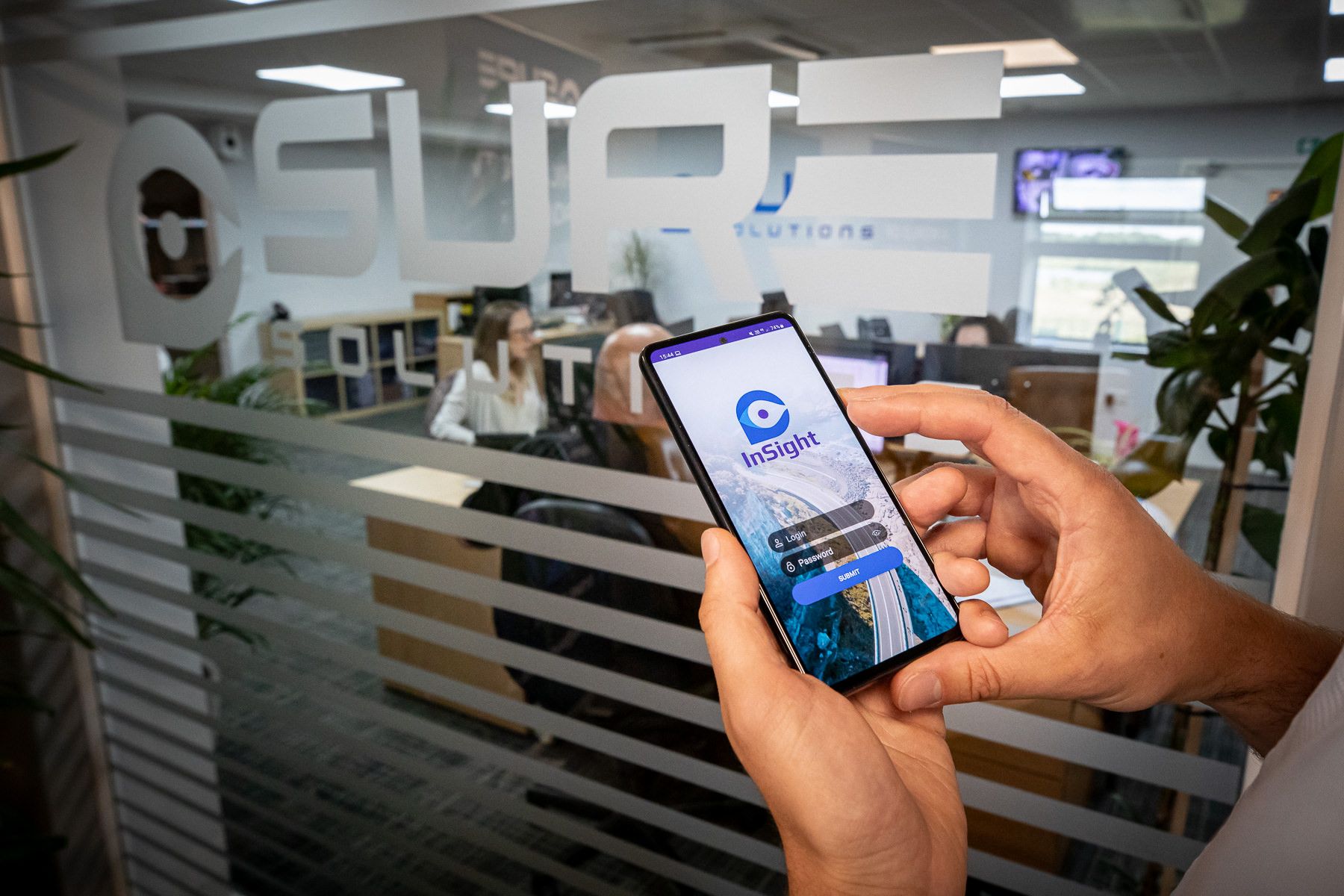 Sure Insight VMS on a phone at the SURE office